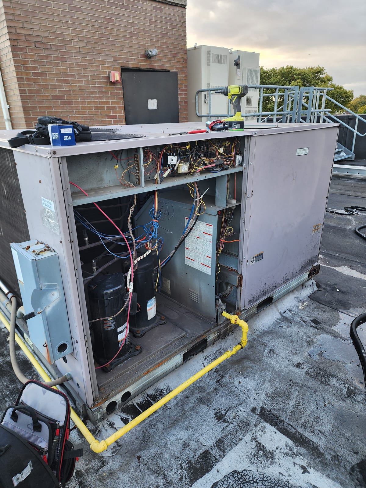 Mitsubishi VRF condensers on Manhattan rooftop with skyline